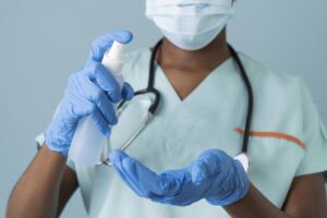 close up doctor using disinfectant